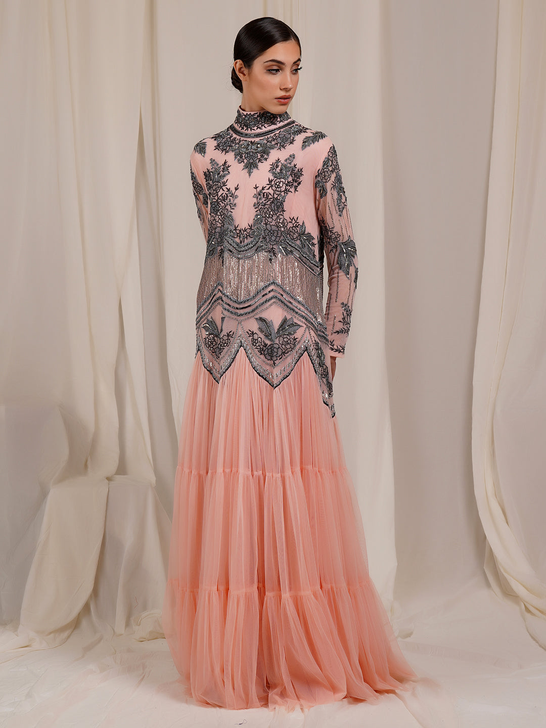 A-Line, High Neck Gown in net At The Top That Is Adorned With Unique Patterns