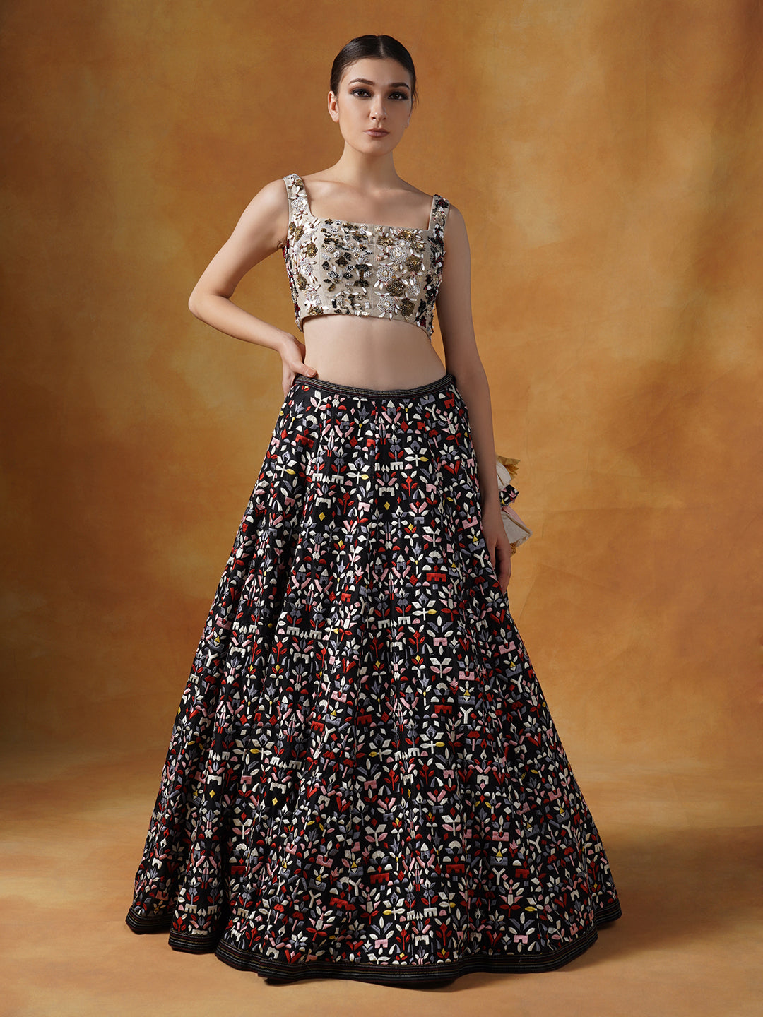Organza jacket with black appliqué work, topped over a lehenga set