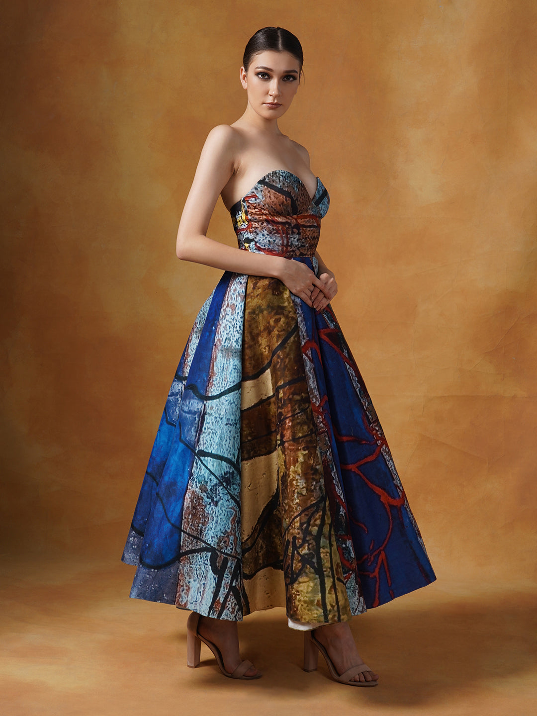 A fun printed tube gown with smart pleats in cotton silk.