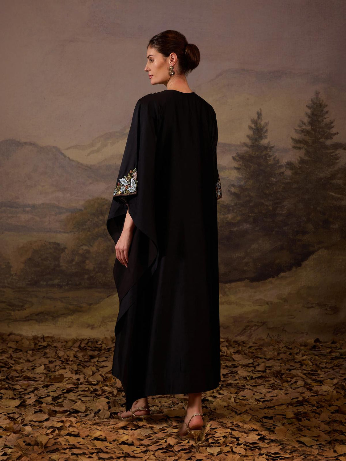A comfortable yet elegant black caftan-style dress.