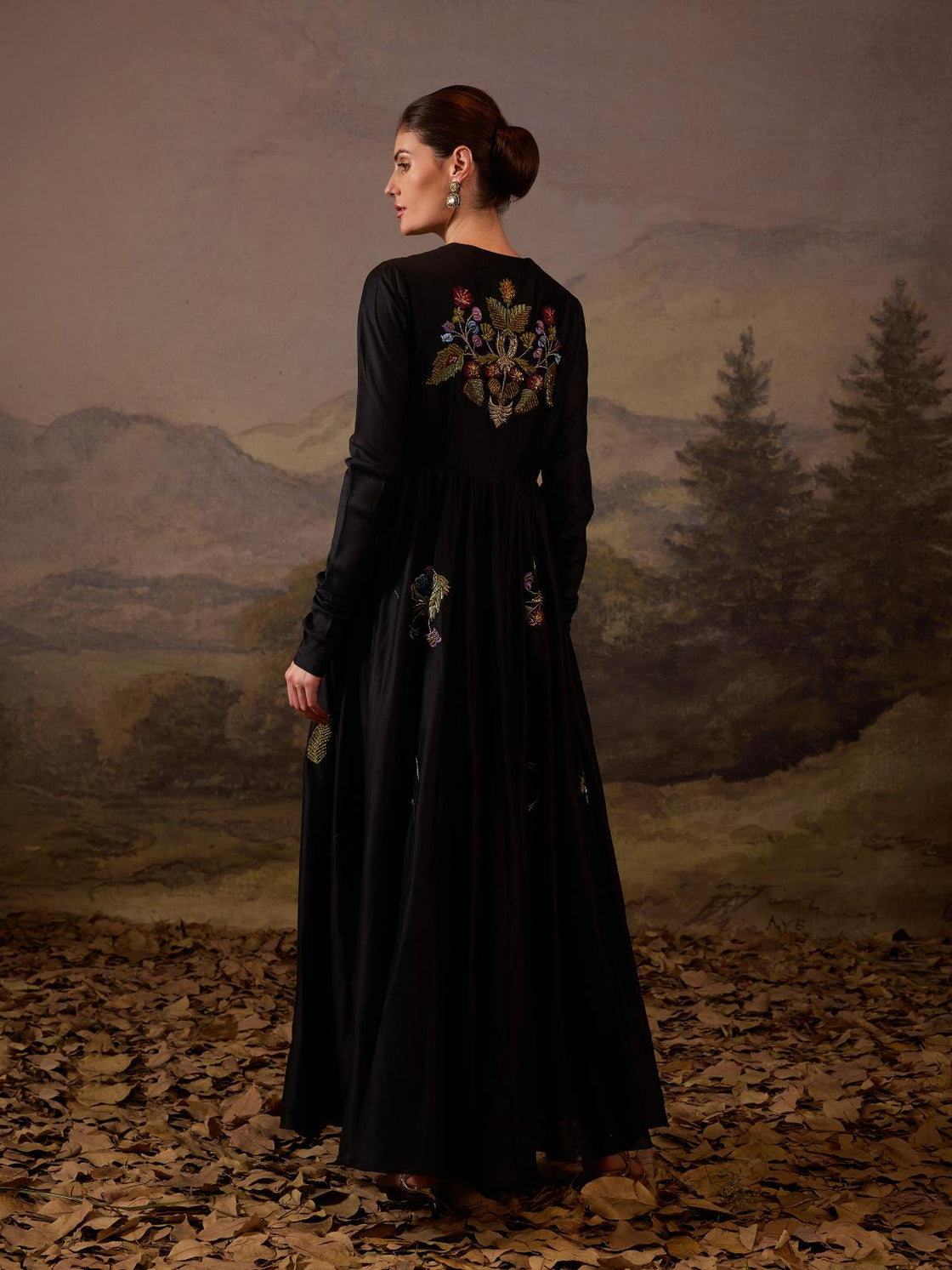 A elegant black floor-length anarkali-style dress.