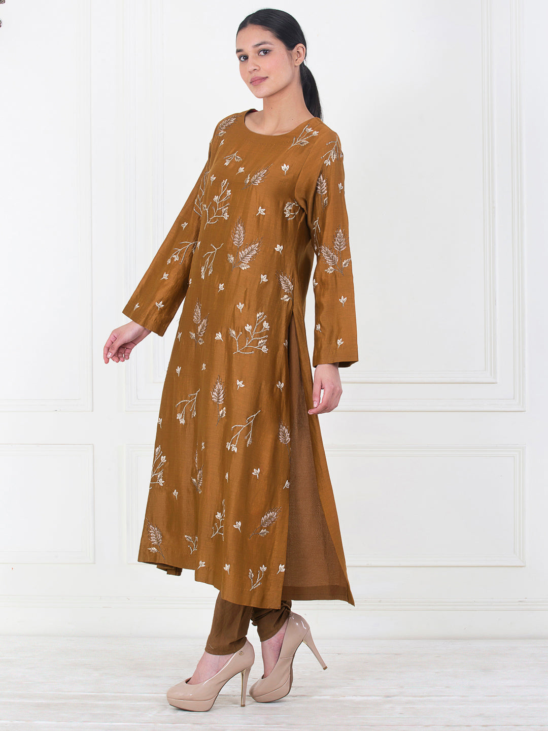 A brown cotton silk kurta that is embroidered in the front