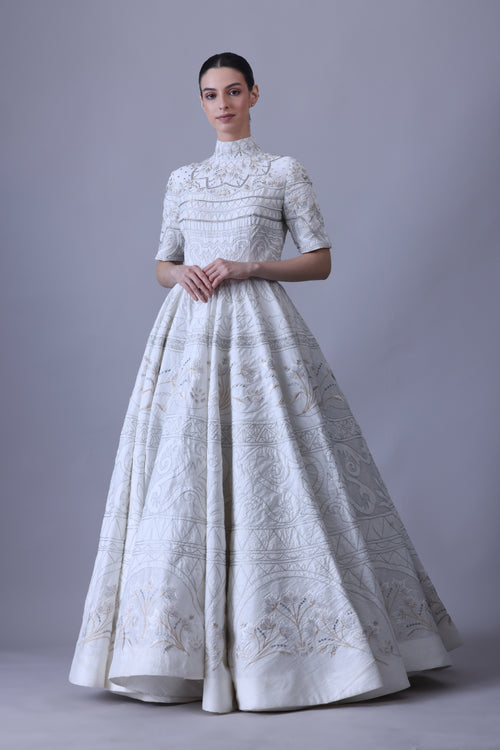 this high-neck gown features half sleeves and intricate threadwork