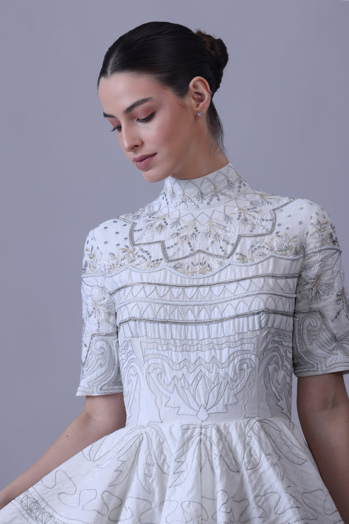 this high-neck gown features half sleeves and intricate threadwork