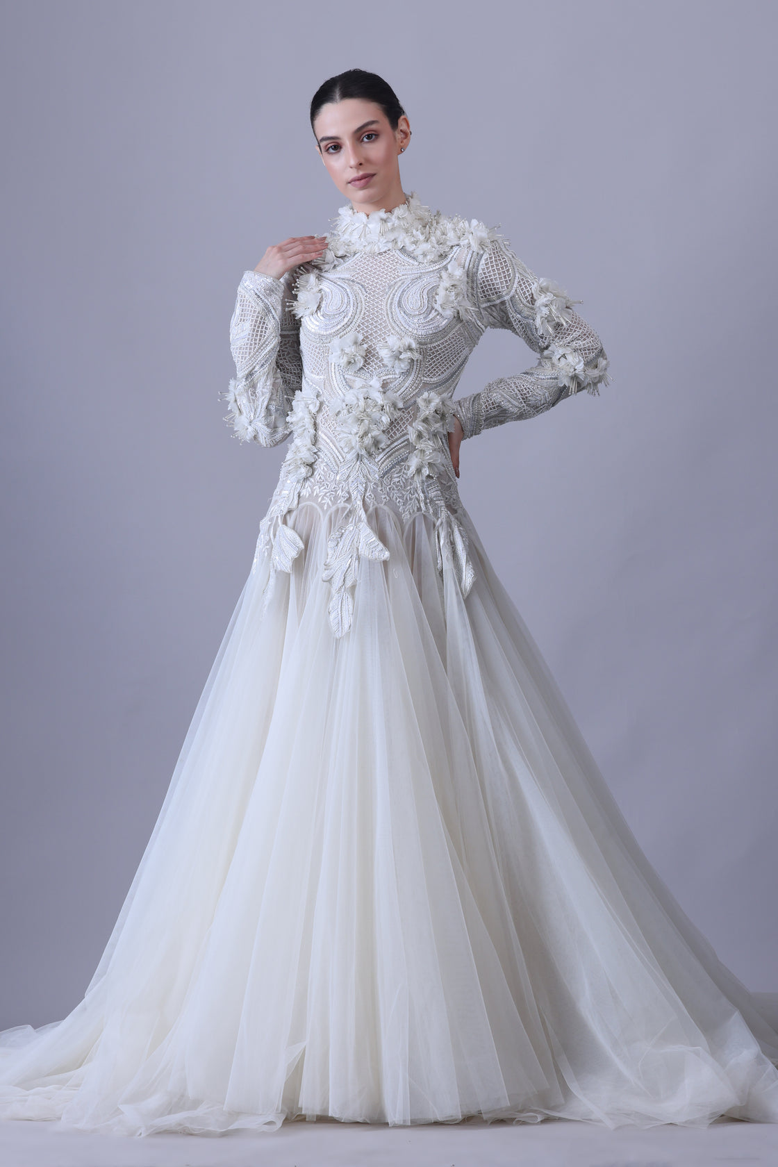 A white  floor length gown with 3d work details & zero neck line