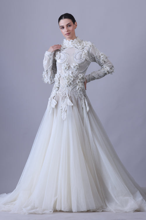 A white  floor length gown with 3d work details & zero neck line