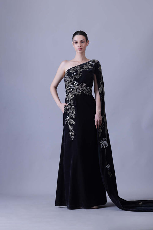 Elegant Black Gown Featuring A One-Shoulder Bodice With Embroidered Detailing