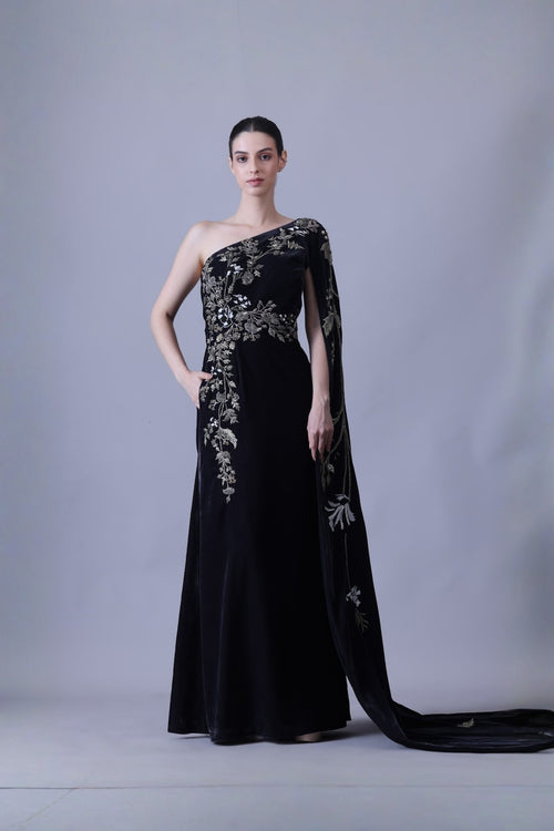 Elegant Black Gown Featuring A One-Shoulder Bodice With Embroidered Detailing