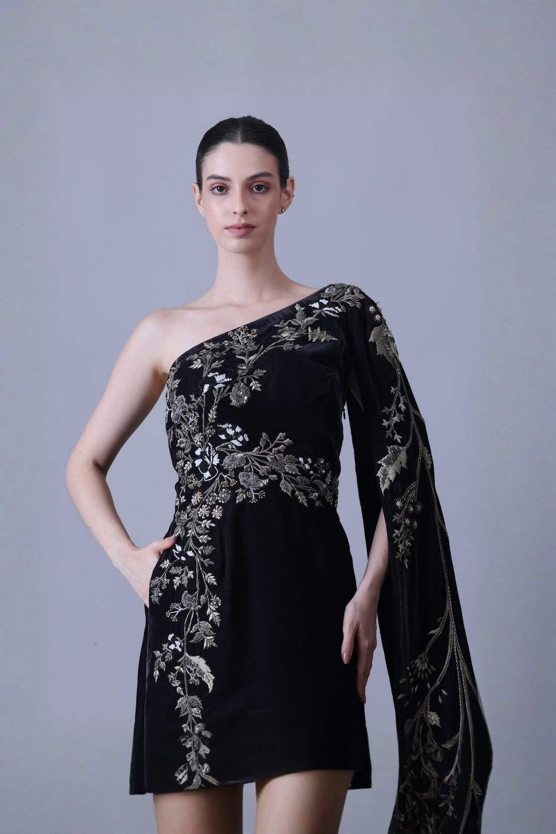 Elegant Black Gown Featuring A One-Shoulder Bodice With Embroidered Detailing