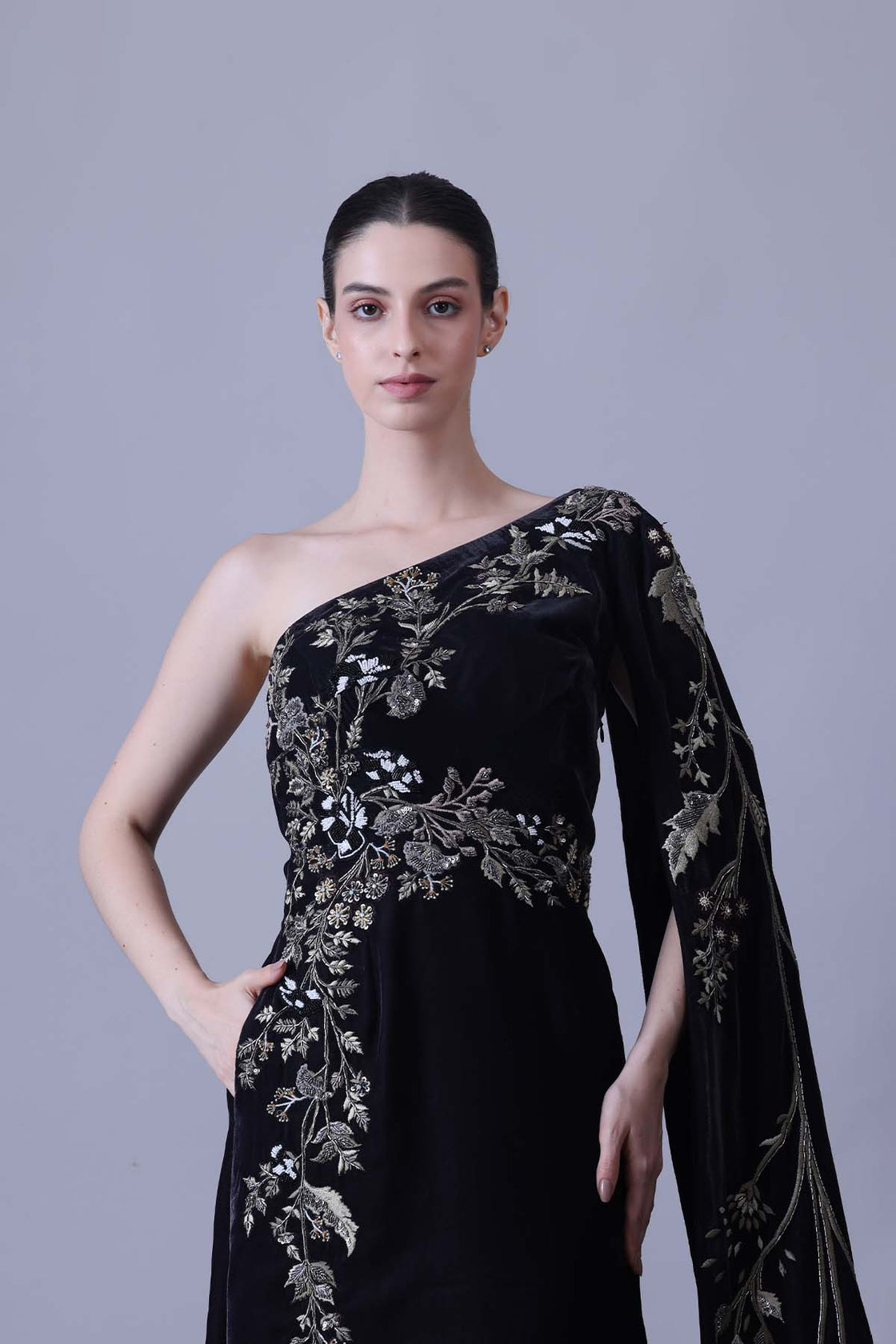 Elegant Black Gown Featuring A One-Shoulder Bodice With Embroidered Detailing