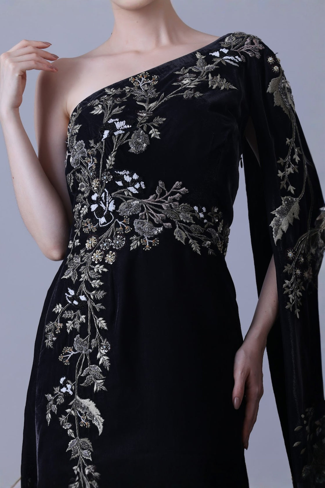 Elegant Black Gown Featuring A One-Shoulder Bodice With Embroidered Detailing