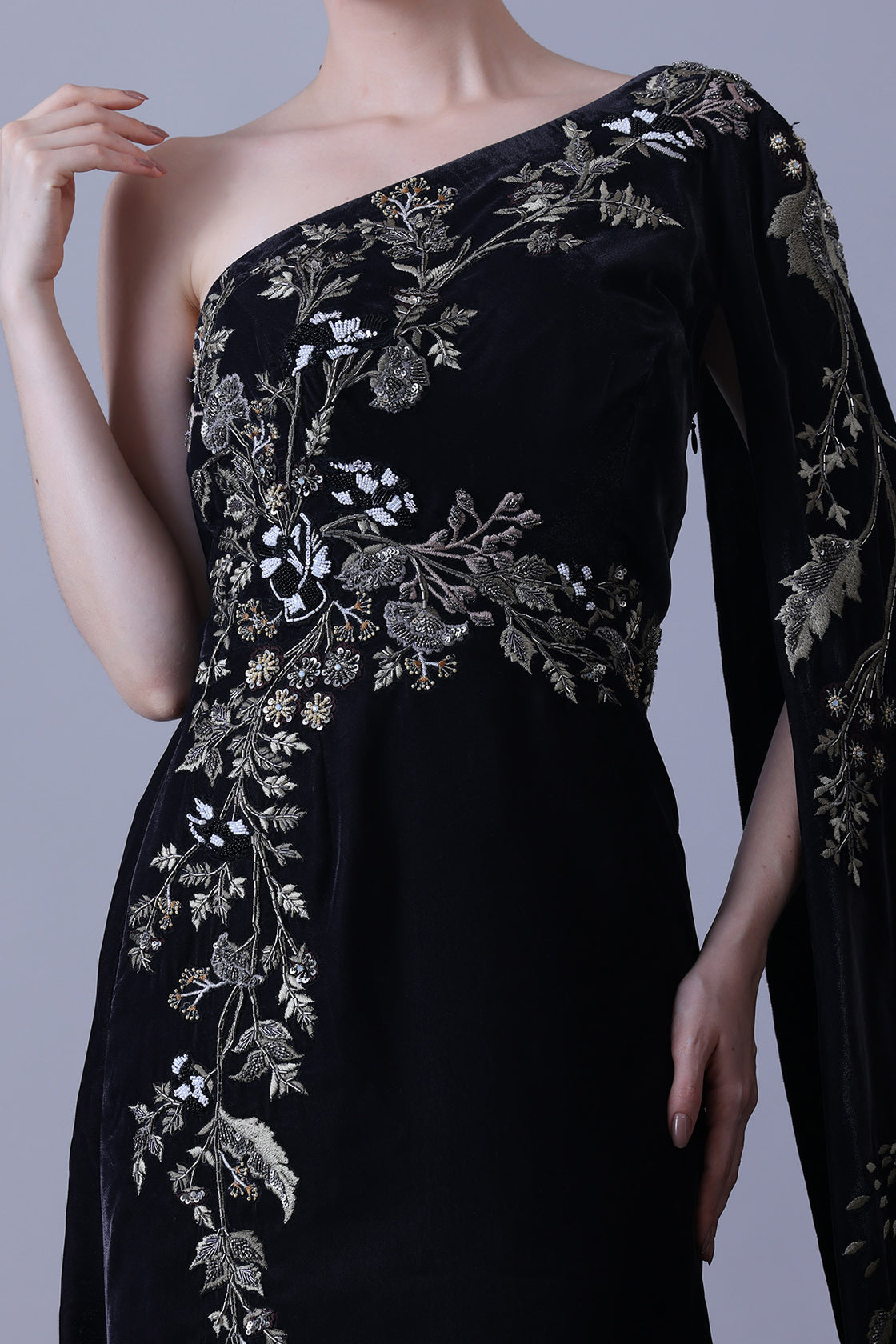 Elegant Black Gown Featuring A One-Shoulder Bodice With Embroidered Detailing