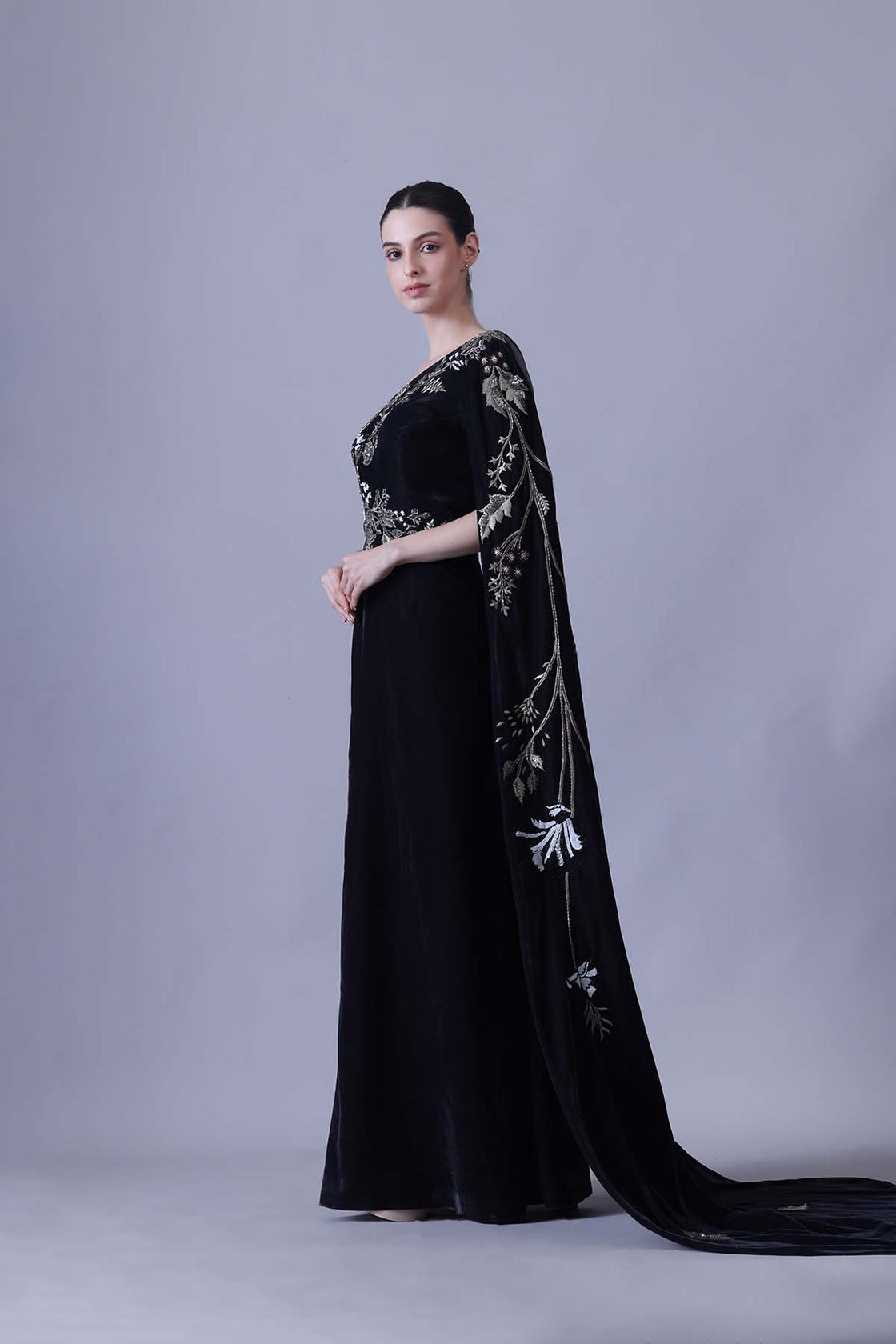 Elegant Black Gown Featuring A One-Shoulder Bodice With Embroidered Detailing