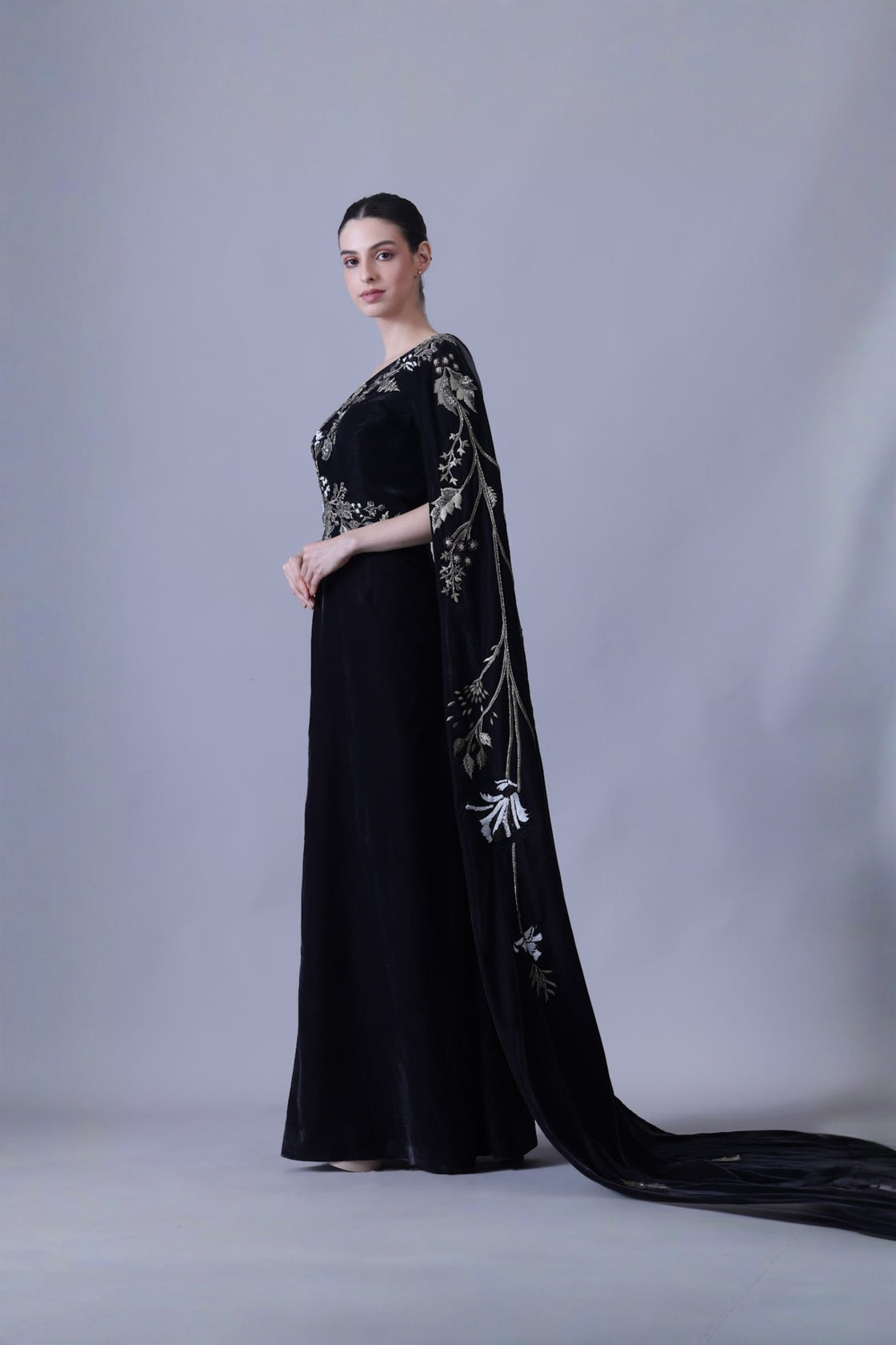 Elegant Black Gown Featuring A One-Shoulder Bodice With Embroidered Detailing