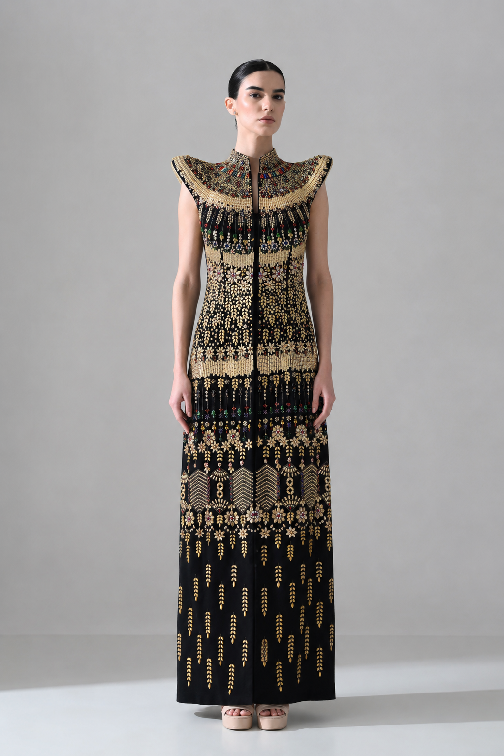 Black Silhouette with Structured Shoulders and Ornate Gold Embroidery