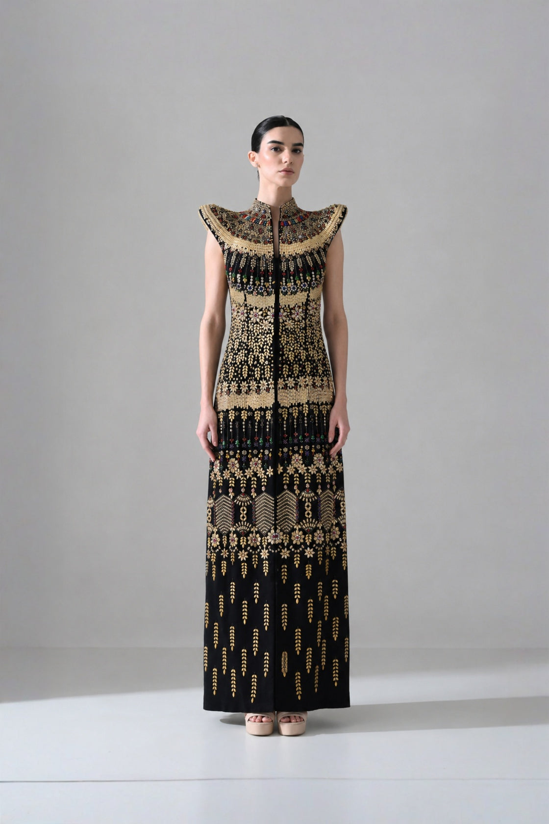 Black Silhouette With Structured Shoulders And Ornate Gold Embroidery