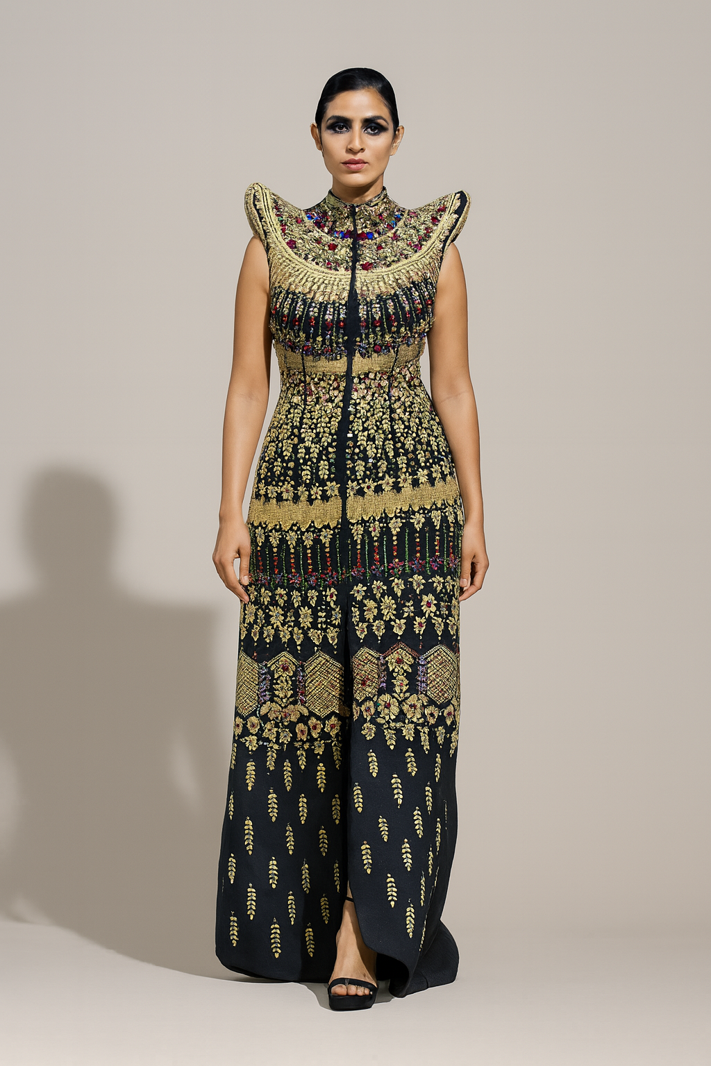 Black Silhouette with Structured Shoulders and Ornate Gold Embroidery