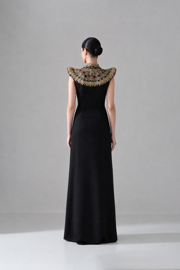 Black Silhouette With Structured Shoulders And Ornate Gold Embroidery
