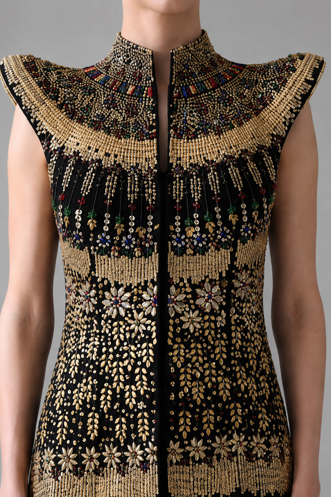 Black Silhouette With Structured Shoulders And Ornate Gold Embroidery