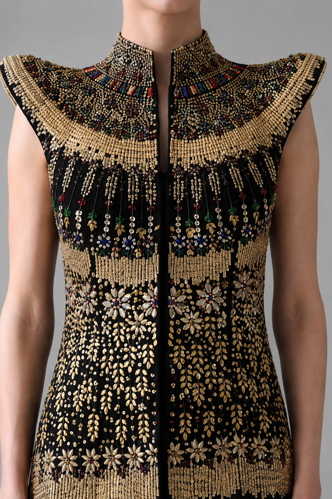 Black Silhouette With Structured Shoulders And Ornate Gold Embroidery