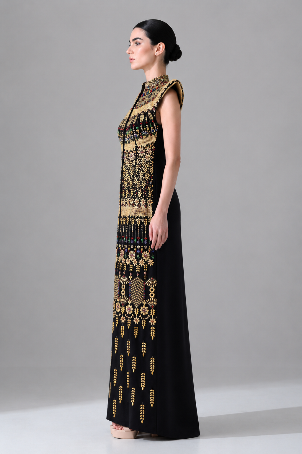 Black Silhouette with Structured Shoulders and Ornate Gold Embroidery