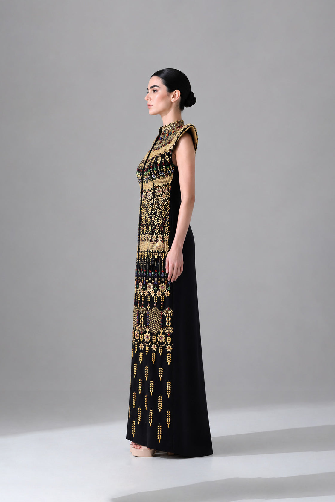 Black Silhouette With Structured Shoulders And Ornate Gold Embroidery