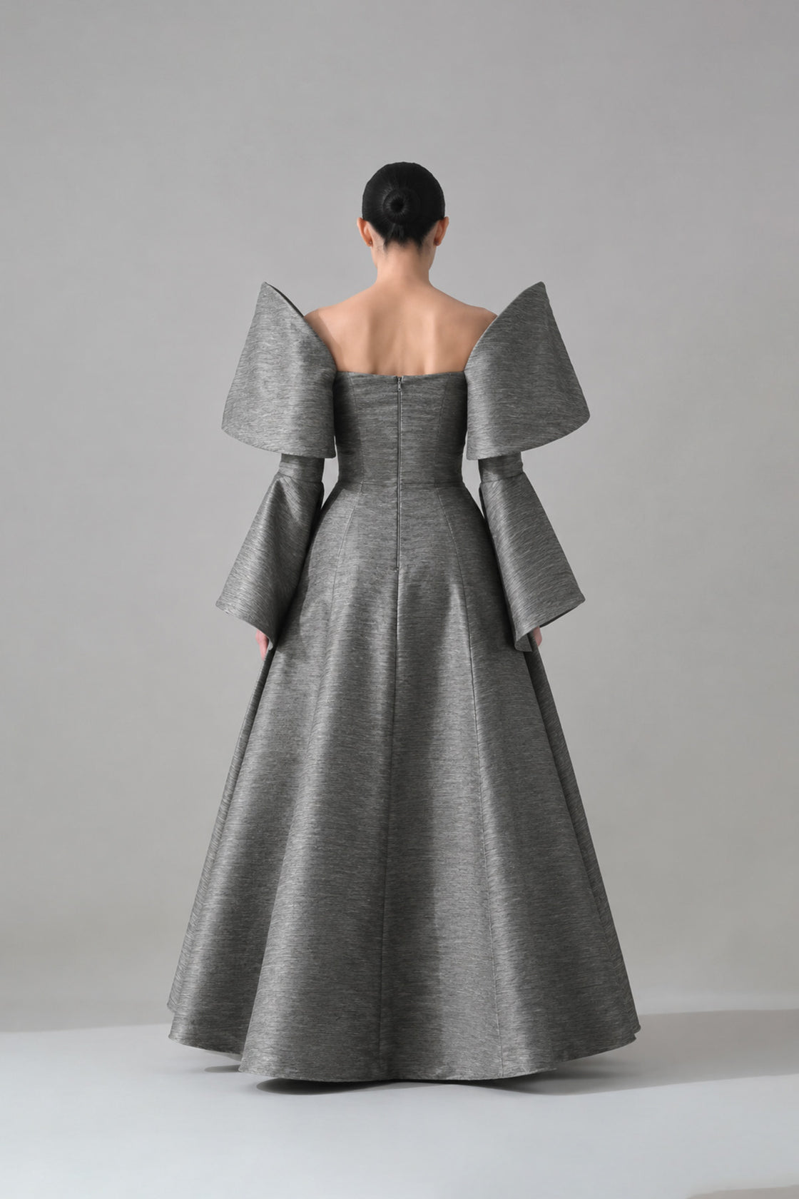 Grey Gown With Embellished Panels And Structured Sleeves Detail