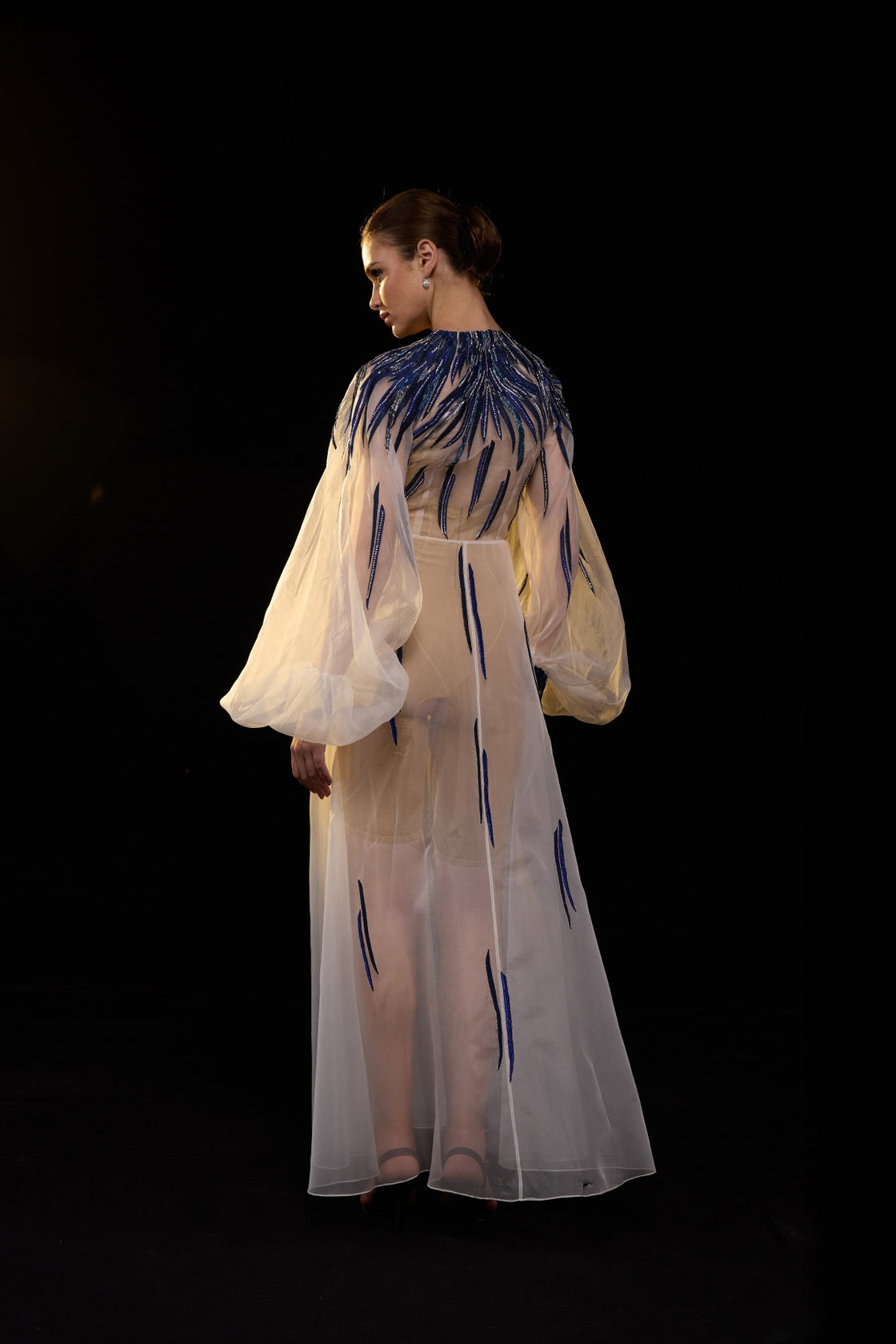 Ivory Sheer Overlay Gown With Cobalt Embellishments And Vibrant Beadwork.