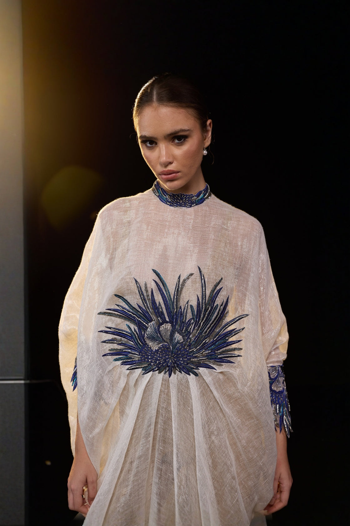 Ivory Draped Gown With Blue Statement Embroidery, High Neckline And Flowly Kaftan-Style Silhouette