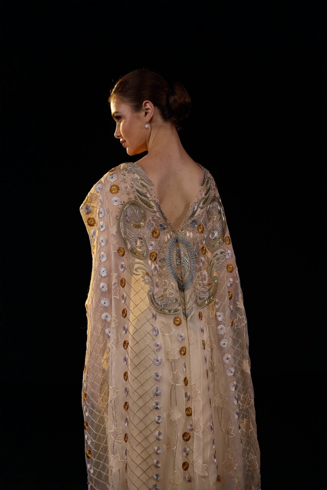 Ivory Embroidered Gown With Sheer Embellished Cape Sleeves And Intricate Metallic Detailing