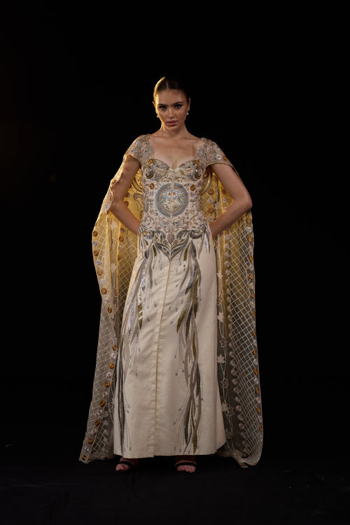 Ivory Embroidered Gown With Sheer Embellished Cape Sleeves And Intricate Metallic Detailing