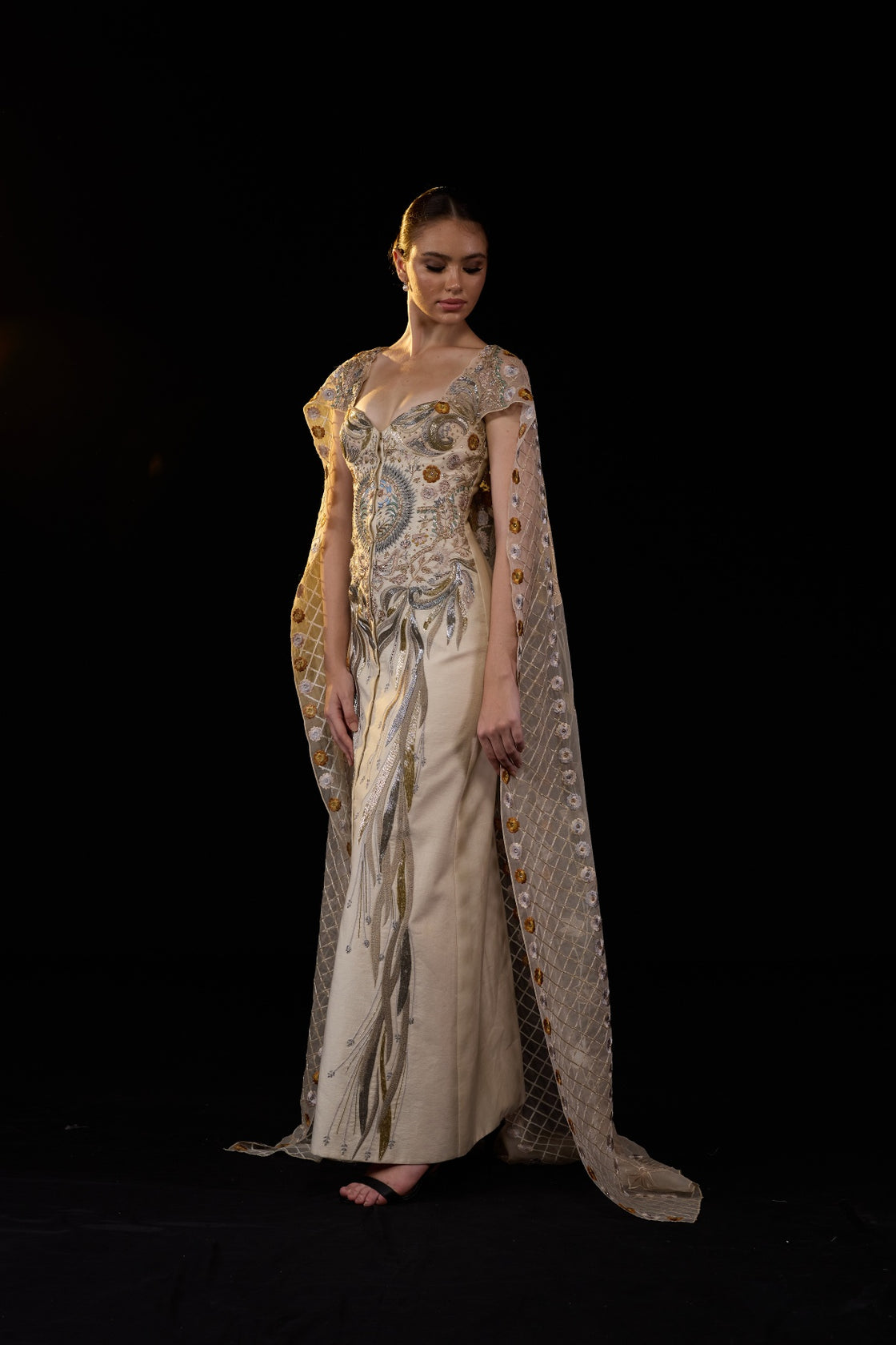 Ivory Embroidered Gown With Sheer Embellished Cape Sleeves And Intricate Metallic Detailing