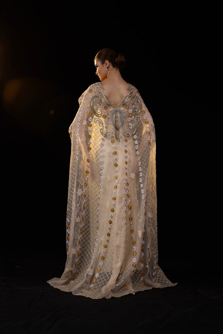 Ivory Embroidered Gown With Sheer Embellished Cape Sleeves And Intricate Metallic Detailing