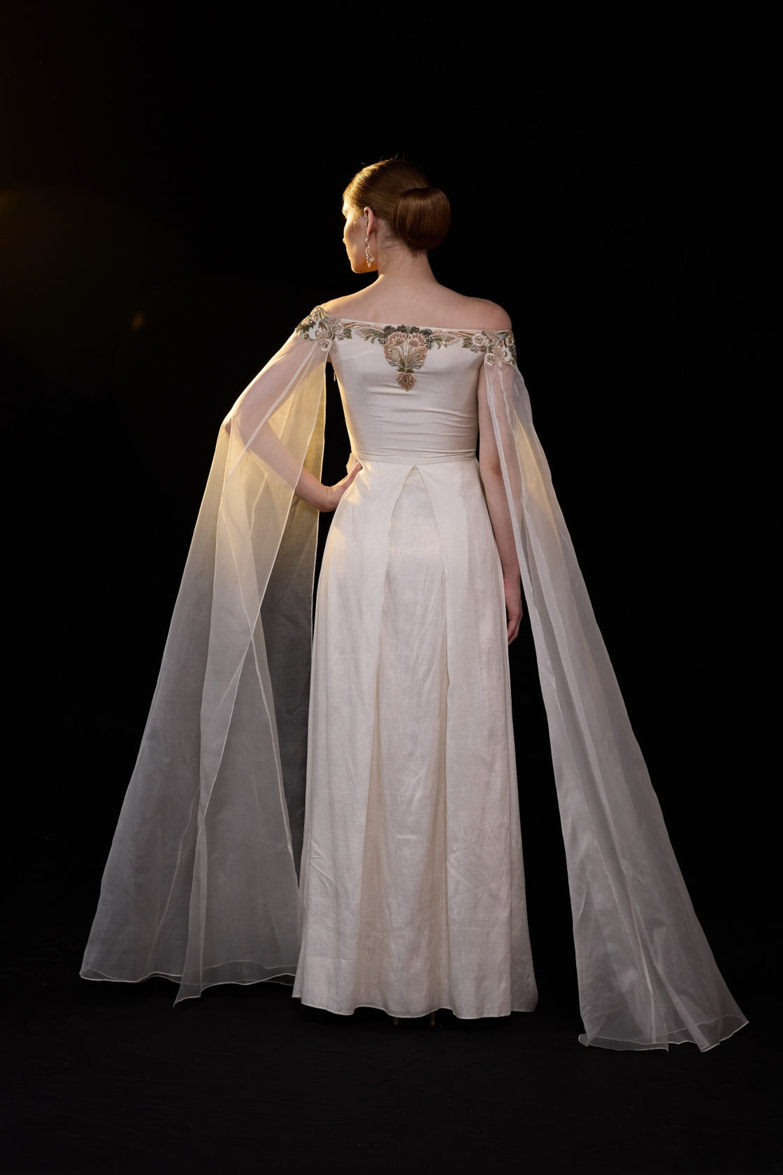 Ivory Off-Shoulder Gown With Floral Embroidery, Sheer Cape Sleeves And A Fluid Floor Length Silhouette