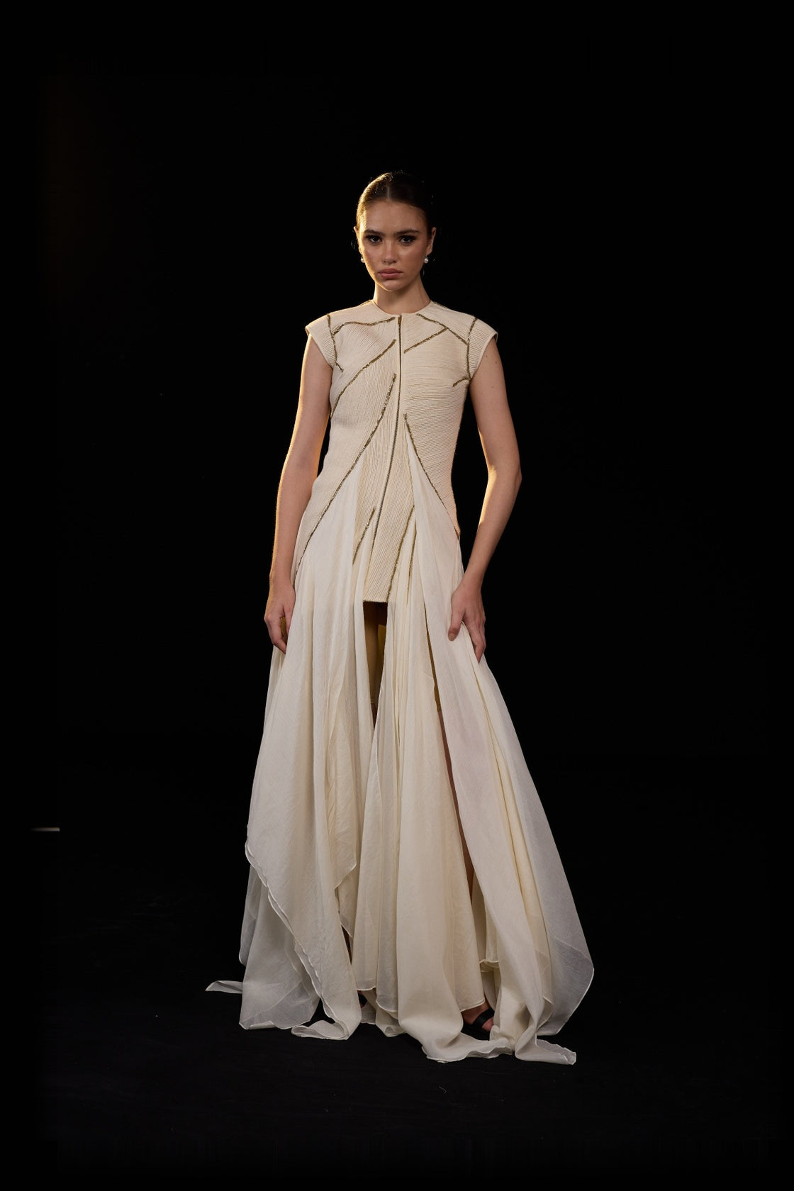 Ivory Structured Gown With Geometric Detailing And Flowing Layered Panels