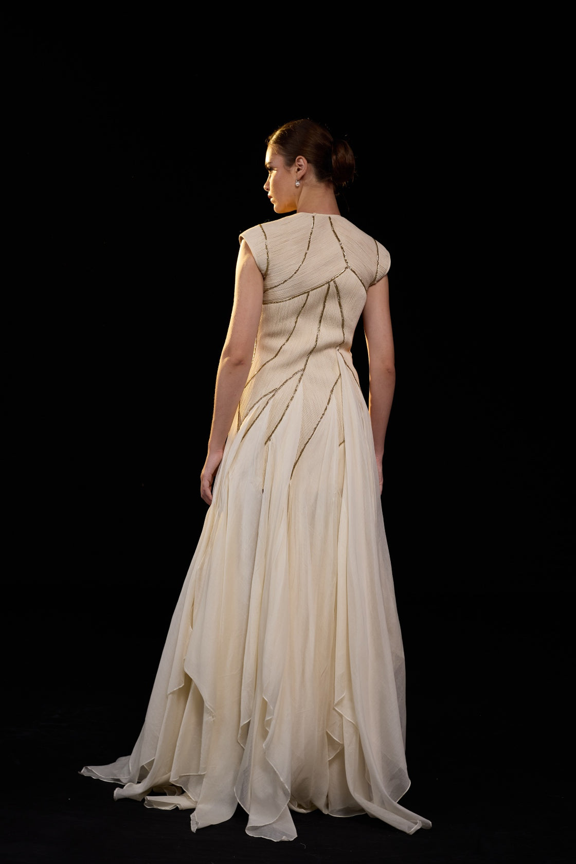 Ivory Structured Gown With Geometric Detailing And Flowing Layered Panels