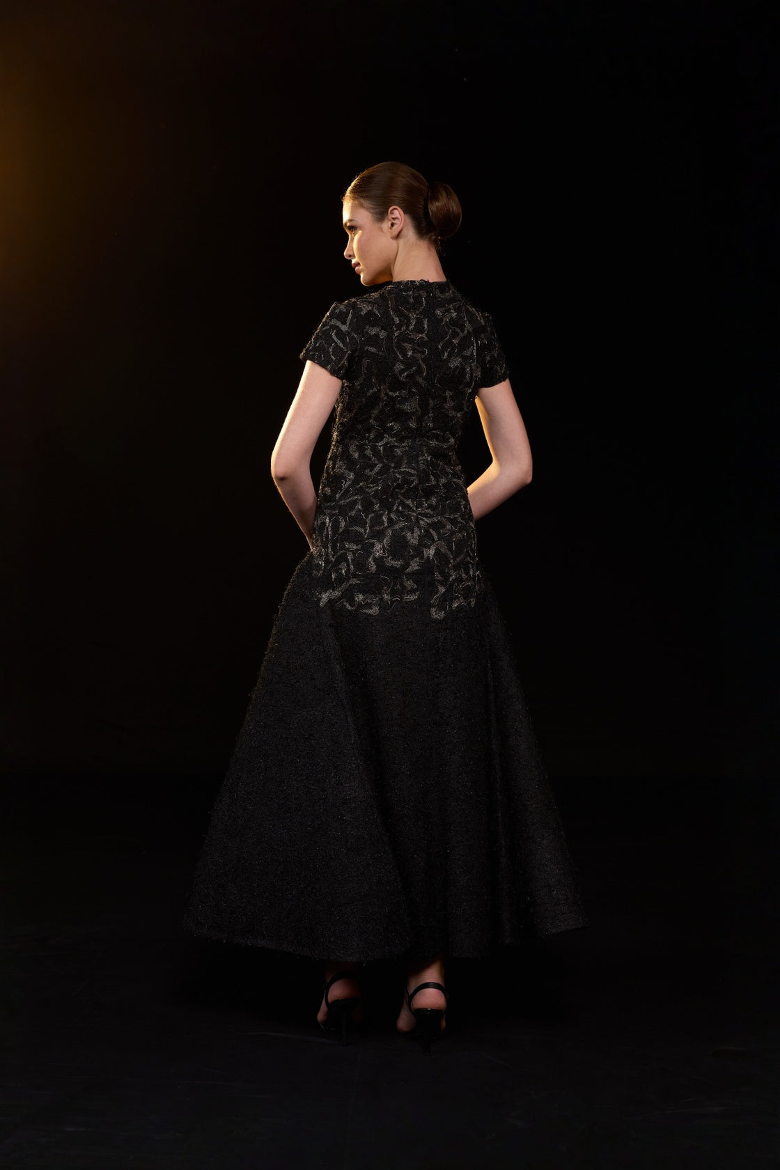 Black Textured Gown With Classic Round Neckline And Voluminous Flared Hem. Intricate Tonal Embellishments