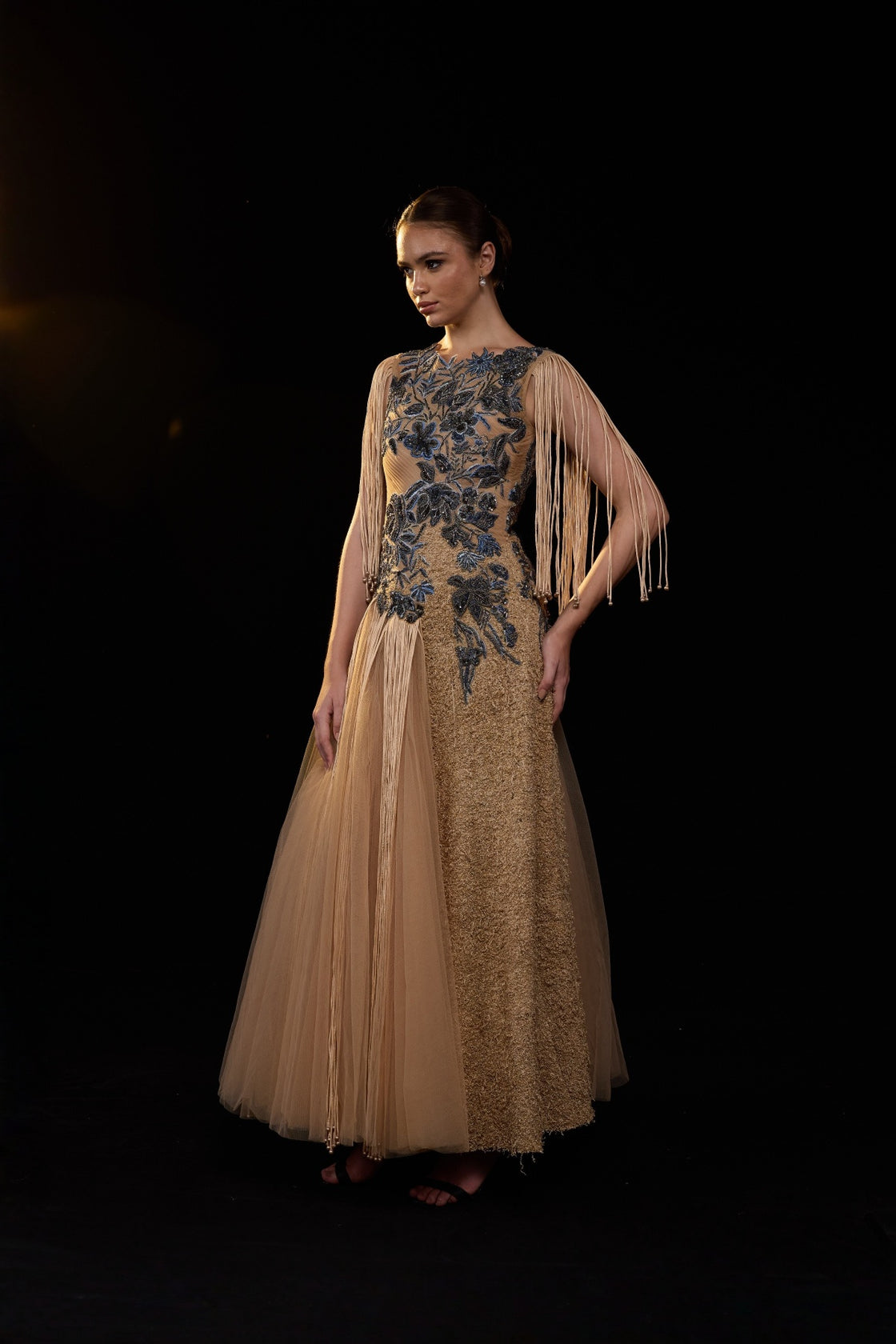 Beige Gown Adorned With Intricate Blue Floral Embroidery And Dramatic Fringe Sleeves
