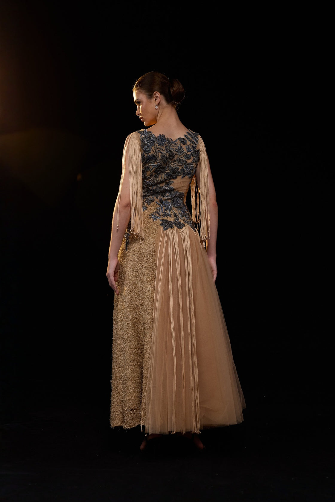 Beige Gown Adorned With Intricate Blue Floral Embroidery And Dramatic Fringe Sleeves