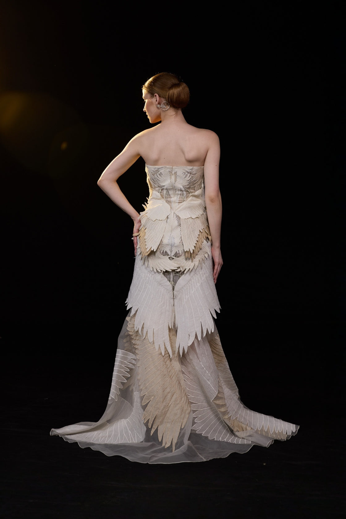Ivory Strapless Mermaid Gown With Sculpted Feather Applique And Intricate Embellisments And Flared Hem