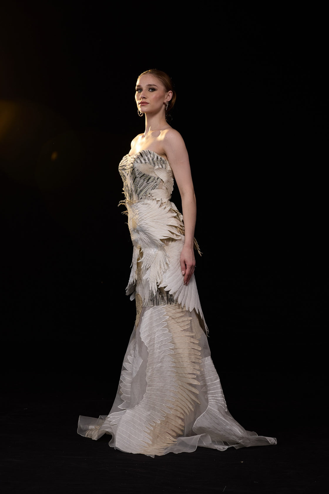 Ivory Strapless Mermaid Gown With Sculpted Feather Applique And Intricate Embellisments And Flared Hem