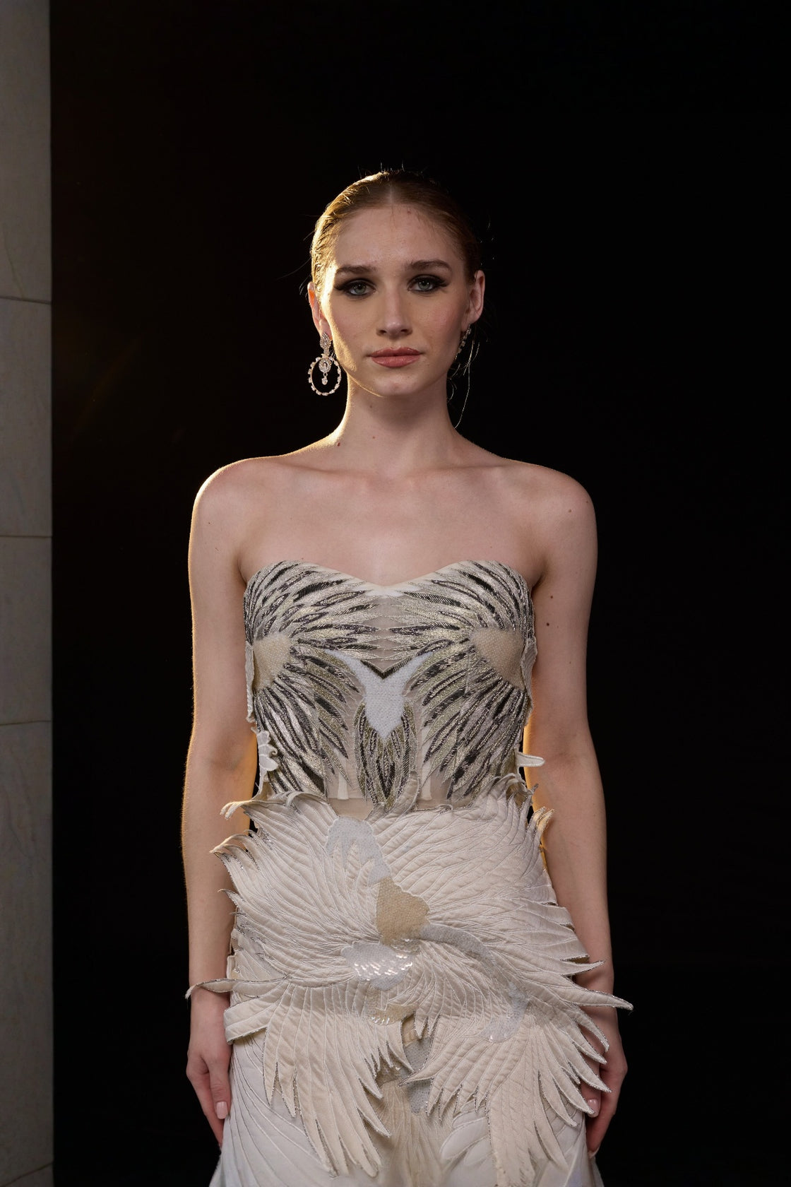 Ivory Strapless Mermaid Gown With Sculpted Feather Applique And Intricate Embellisments And Flared Hem