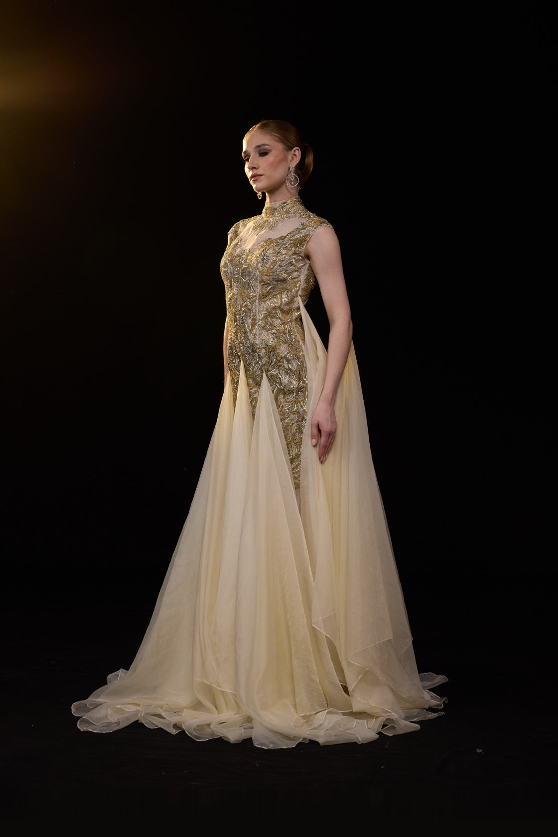 Beige Emebellished Gown With Illusion Neckline And Flowing Layered Drapes. Look Enhanced With A Trail
