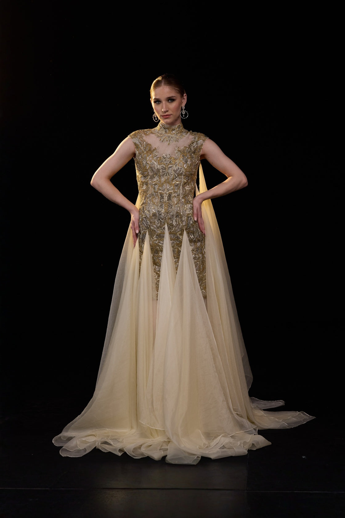 Beige Emebellished Gown With Illusion Neckline And Flowing Layered Drapes. Look Enhanced With A Trail
