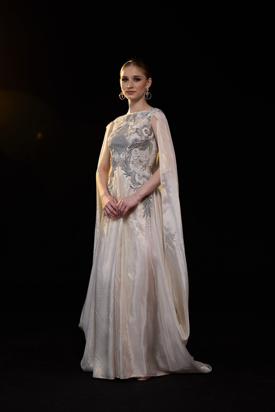 Ivory Draped Gown Embellished With Silver Embroidery And Flowing Draped Sleeves