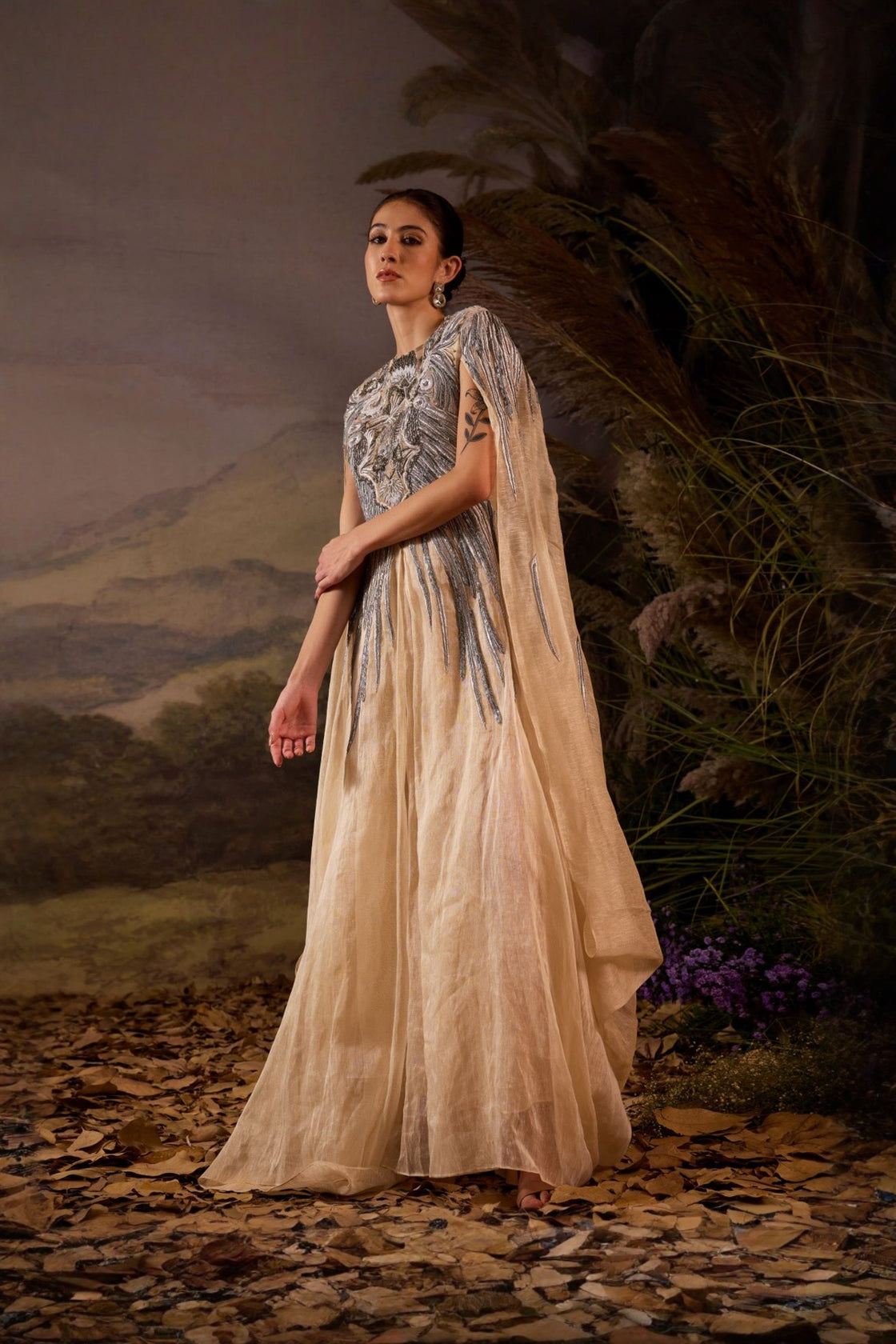 Champagne Cape Gown With Silver Embellishment And Sculpted Bodice