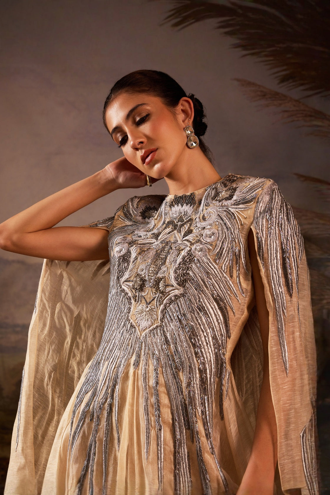 Champagne Cape Gown With Silver Embellishment And Sculpted Bodice