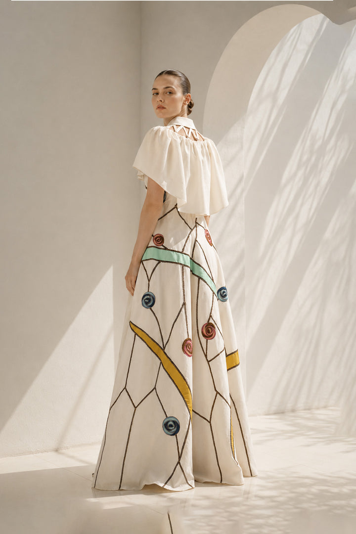 Ivory gown with embroidered cape drama