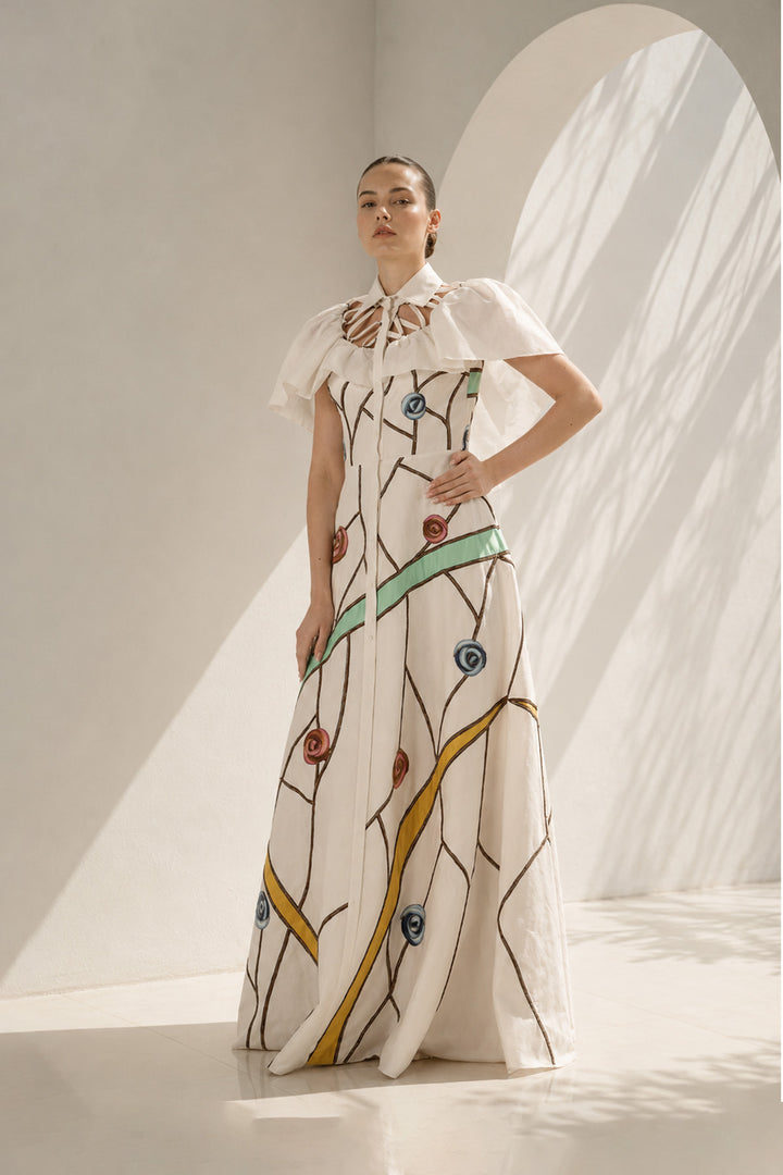 Ivory gown with embroidered cape drama