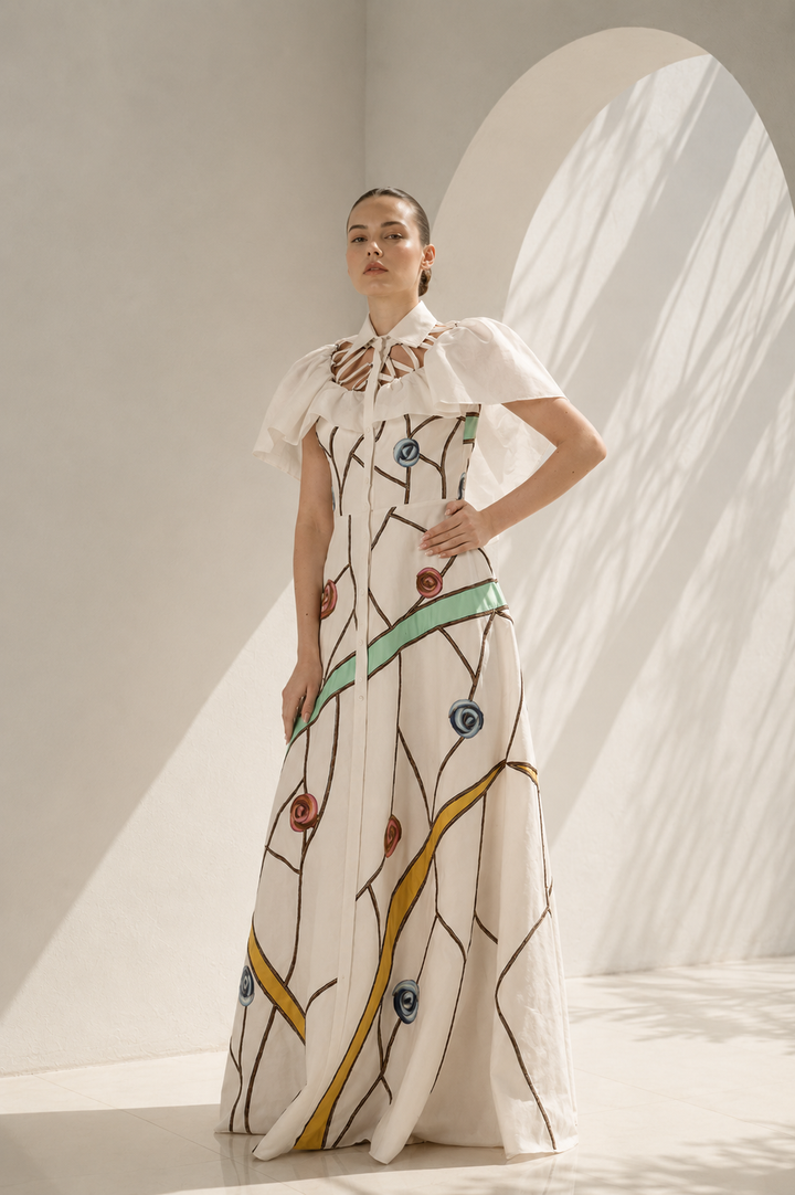 Ivory gown with embroidered cape drama